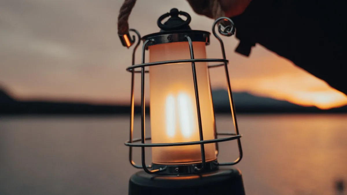 LED lantern glowing on a kitchen counter in a dark house during a storm